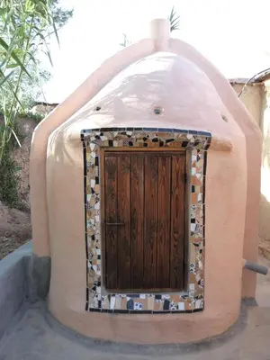 a dome house with a door in the middle at Kasbah Timdaf in Demnat