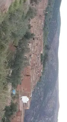 an aerial view of a row of houses next to the water at Dar rachid ouzoud in Azilal