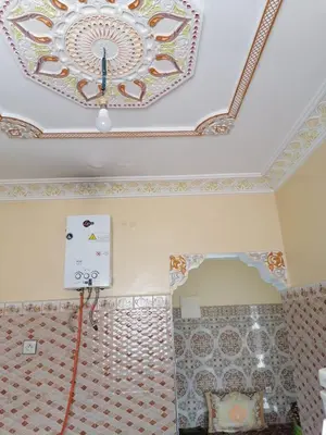 a room with a ceiling with a painting on the ceiling at Dar rachid ouzoud in Azilal
