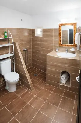 a bathroom with a toilet and a sink at Casa Mona in Merzouga