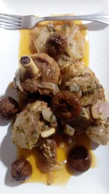 a white plate of food with nuts and a fork at Maison D'hôte La Vallée Des Figues in Tamellalt