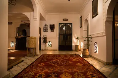 a hallway with a rug on the floor in a building at Auberge Tissadrine in Akhendachou nʼAït Ouffi