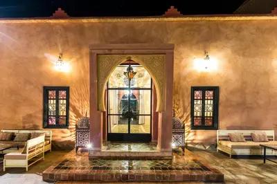 an entrance to a building with a glass door at Riad Madu in Merzouga