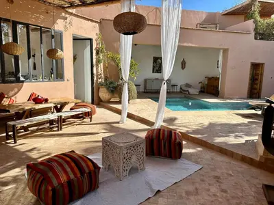 a patio with a swimming pool and a house at VILLA BEL'VIE, PRIVEE, MARRAKECH , PISCINE CHAUFFEE, Wifi, Clim in Douar bel Rhanodour