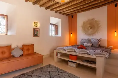 a bedroom with a bed and a couch in it at VILLA BEL'VIE, PRIVEE, MARRAKECH , PISCINE CHAUFFEE, Wifi, Clim in Douar bel Rhanodour