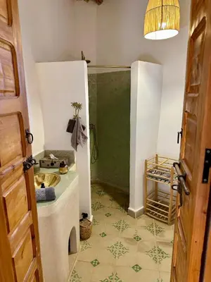 a bathroom with a shower and a sink in a room at VILLA BEL'VIE, PRIVEE, MARRAKECH , PISCINE CHAUFFEE, Wifi, Clim in Douar bel Rhanodour