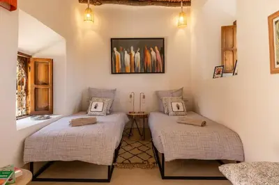a room with two twin beds in a room at VILLA BEL'VIE, PRIVEE, MARRAKECH , PISCINE CHAUFFEE, Wifi, Clim in Douar bel Rhanodour