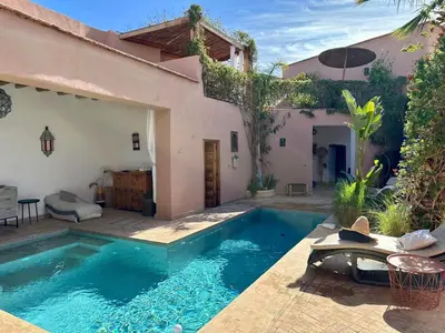 a swimming pool in front of a house at VILLA BEL'VIE, PRIVEE, MARRAKECH , PISCINE CHAUFFEE, Wifi, Clim in Douar bel Rhanodour