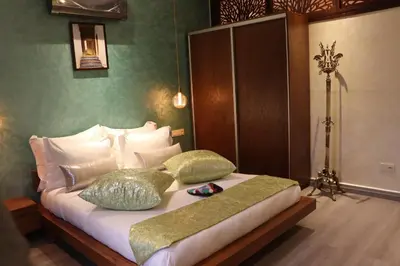 a bedroom with a bed with two pillows on it at Luxury Appartement Noor in Fès