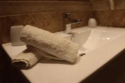 a roll of toilet paper sitting on top of a bathroom sink at Luxury Appartement Noor in Fès