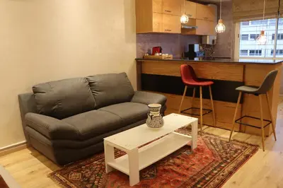 a living room with a couch and a table at Luxury Appartement Noor in Fès