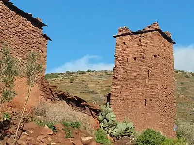 an old brick building on the side of a hill at Abla room in Azilal