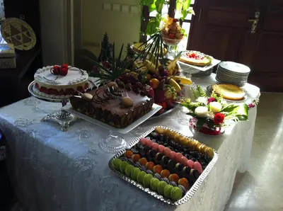 a table with cakes and other food on it at Riad Les Chrifis Navette Aéroport 24 sur 24 in Fès