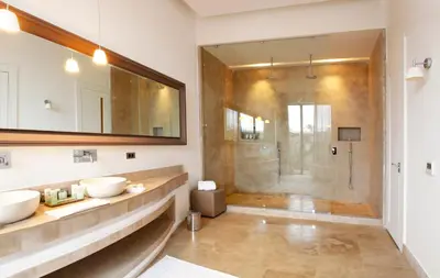 a bathroom with two sinks and a shower at Palais Namaskar in Marrakech