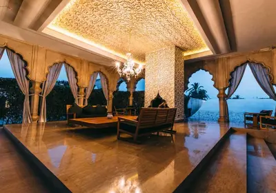 a living room with a couch and a chandelier at Palais Namaskar in Marrakech
