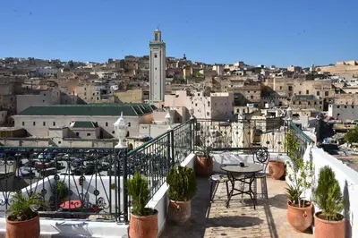 a balcony with a view of a city at Riad Fes EL KAID in Fès