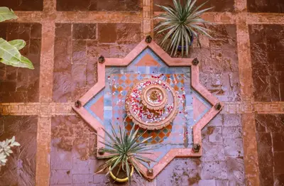 a wall with a painting on the side of a building at Riad Kasbah Omar in Ourika