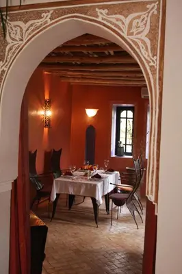 a dining room with a table and chairs at VILLA CATHERINE MARRAKECH in Marrakech