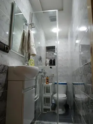 a bathroom with a toilet and a sink and a shower at Ryan S1et Ryan S2 in Fès