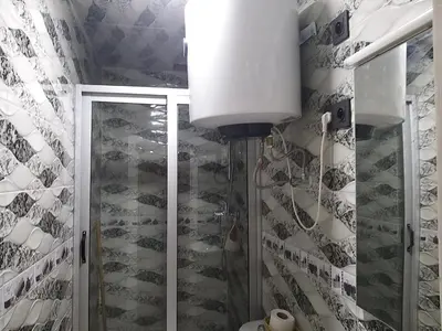 a bathroom with a shower with a glass door at Ryan S1et Ryan S2 in Fès