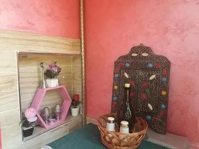 a dressing room with a mirror and a bottle of wine at Ryan S1et Ryan S2 in Fès