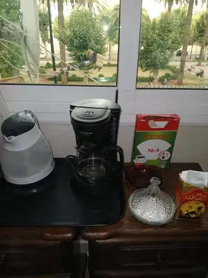 a counter with a coffee maker on a table at Ryan S1et Ryan S2 in Fès