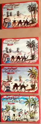 three books on the wall with camel and palm trees at Le Sauvage Noble in Tissergat