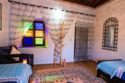 a bedroom with two beds and a window at Villa privée Wafa in Marrakech