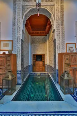 a swimming pool in a building with a mosque at RIAD LOUDAYA AND SPA in Fès
