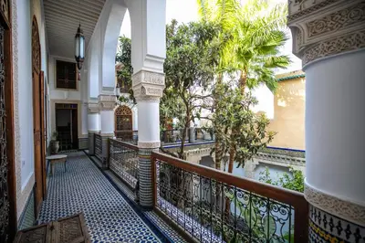 a corridor of a building with a balcony at RIAD LOUDAYA AND SPA in Fès