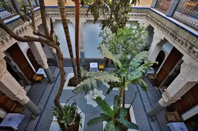 an overhead view of a courtyard with palm trees at RIAD LOUDAYA AND SPA in Fès