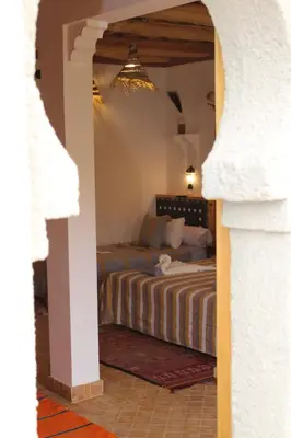 a bedroom with a bed in a room at Dar Mezyana Dades in Aït Idaïr