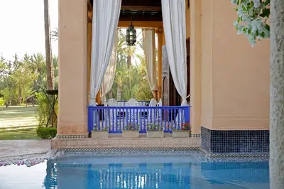 a house with a swimming pool in front of a building at Ame-Za in Douar Soukkane
