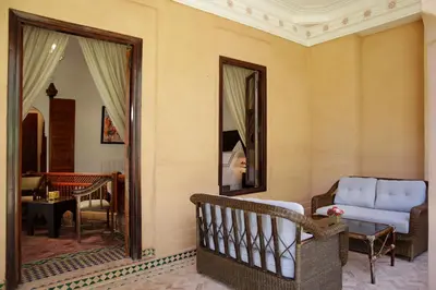 a living room with a couch and a mirror at Ame-Za in Douar Soukkane