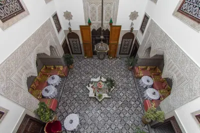 an overhead view of a restaurant with tables and chairs at Riad Pacha Palace in Fès