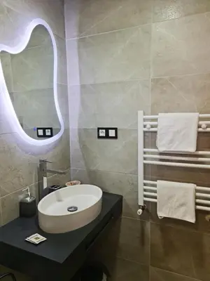 a bathroom with a sink and a mirror at Maurice Bonjean in Ifrane