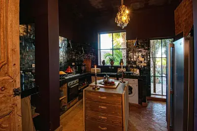 a kitchen with a sink and a stove top oven at Aux portes de Marrakech Villa Arts & Déco avec piscine in Marrakech