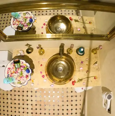 a bathroom sink with sprinkles on a counter at kasbah yu palace in Ouarzazate