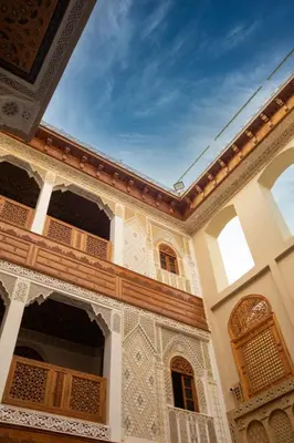 a courtyard of a building with white and brown tiles at Riad Sayeda Al Hora in Fès