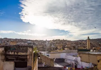 a view of a city under a cloudy sky at dar Benfares rcif in Fès