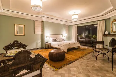 a large bedroom with a bed and a large orb at La Villa Rose Anna in Marrakech