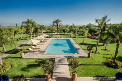 an image of a swimming pool in a resort at La Villa Rose Anna in Marrakech