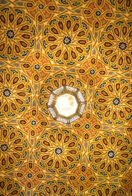 a close up of a ceiling with a tile pattern at Palais Fes Yahya - family hosting in Fès al Bali