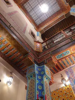 a room with a ceiling with colorful tiles on it at Palais Fes Yahya - family hosting in Fès al Bali