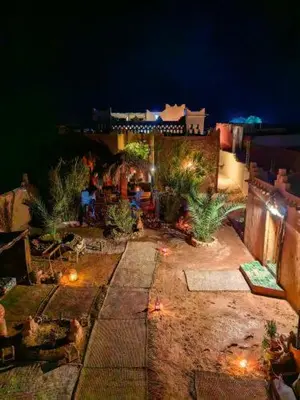 an aerial view of a patio at night at Auberge Kasbah Dar Sahara Tours in Mhamid