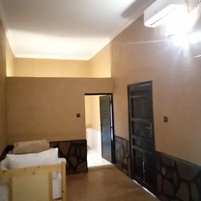a room with a room with a door and a hallway at La perle de saghro in Nkob