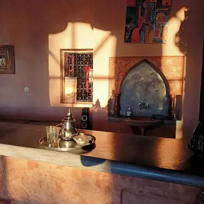a kitchen with a table with a tea kettle on it at LESCALE DE OUARZAZATE in Ouarzazate