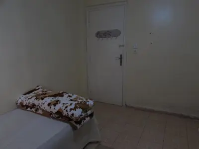 a bedroom with a white door and a bed with a blanket at Bed and breakfast in Ifrane
