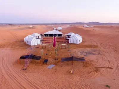 an aerial view of a building in the desert at Luxury Camp Merzouga in Merzouga