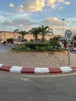 a street corner with a sign on the side of a road at Riad le petit ksar in Meknès
